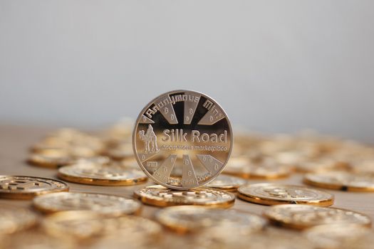 Digital currency physical bitcoin coin. Gold background coins concept.
