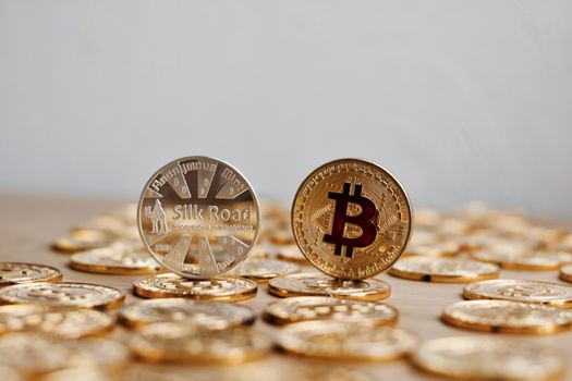 Digital currency physical bitcoin coin. Gold background coins concept.