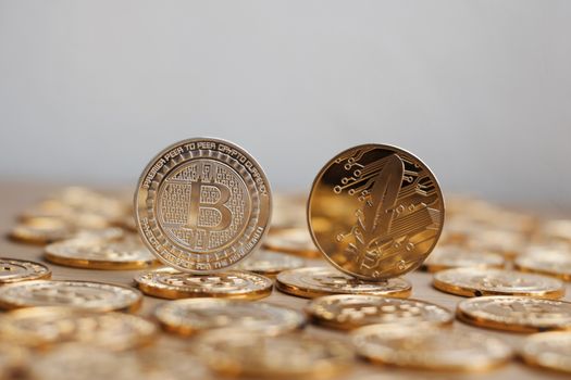 Digital currency physical bitcoin coin. Gold background coins concept.