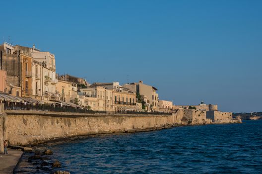 Syracuse, Italy - August 31, 2017: Sunset in Embankment of Ortygia island, Syracuse city, in Sicily.