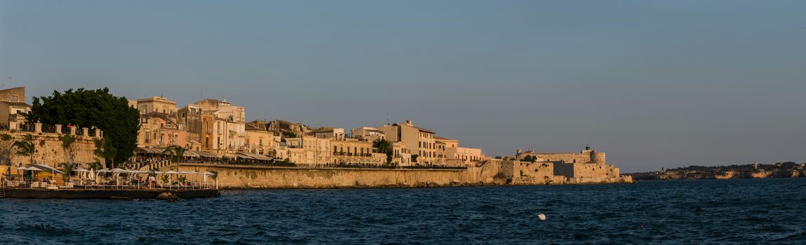 Panorama of Embankment of Ortygia island in sunset, Syracuse city, in Sicily.