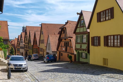 Dinkelsbuhl, Germany - August 28, 2010: Street view of Dinkelsbuhl, one of the archetypal towns on the German Romantic Road with traditional frameworks ( Fachwerk ) house.