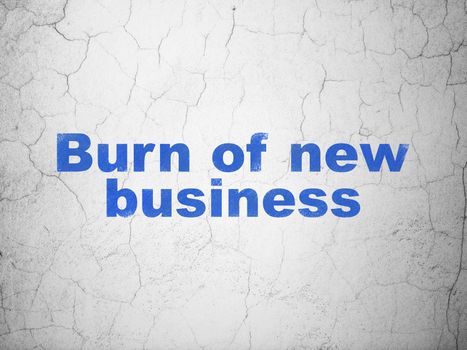 Finance concept: Blue Burn Of new Business on textured concrete wall background