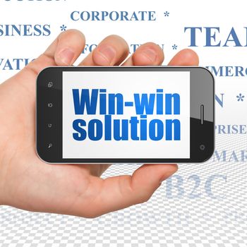 Business concept: Hand Holding Smartphone with  blue text Win-win Solution on display,  Tag Cloud background, 3D rendering
