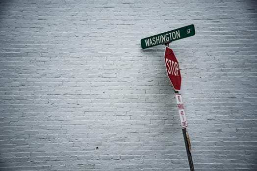 Washington Street road sign in front of a white wall