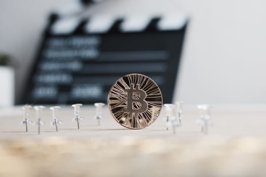 Digital currency physical metal bitcoin coin. Cryptocurrency cinema concept.