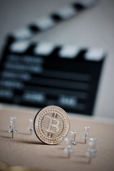 Digital currency physical metal bitcoin coin. Cryptocurrency cinema concept.