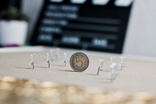 Physical polish coin near cinema board. Polish money lifestyle concept.