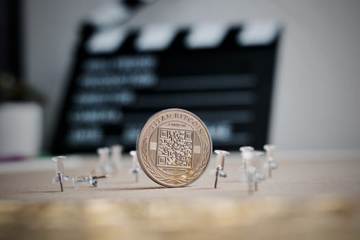 Digital currency physical metal bitcoin coin. Cryptocurrency cinema concept.