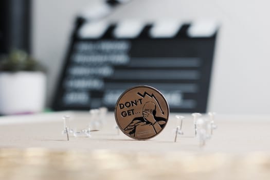 Digital currency physical metal bitcoin coin. Cryptocurrency cinema concept.