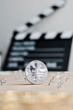 Digital currency physical metal bitcoin coin. Cryptocurrency cinema concept.