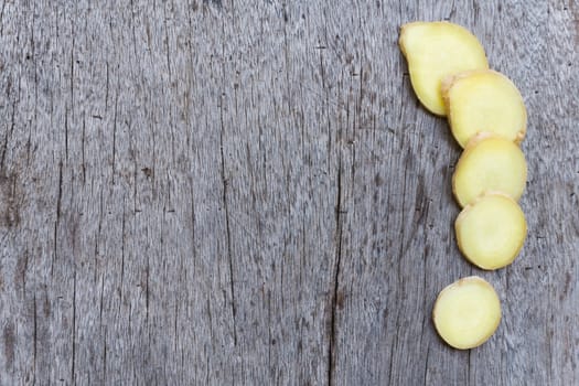 Closeup ginger roots with wood background, coppy space for text or ginger product concept