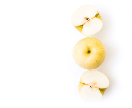 Closeup top view hinese pear fresh fruit with slices on white background, selective focus