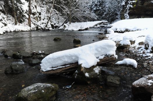 Winter river with snow in the Czech Switzerland