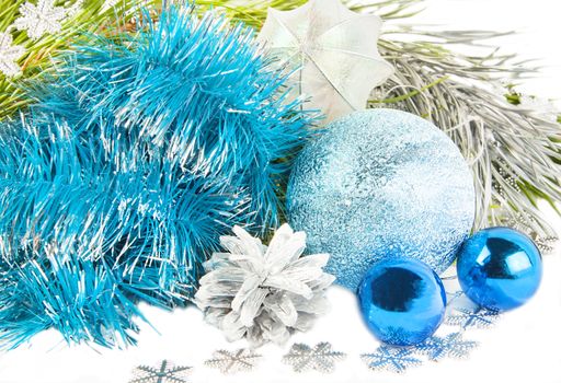 New year and Christmas composition with blue tinsel, fir tree on white