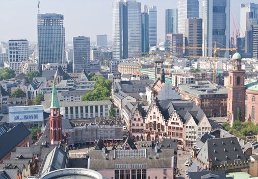 Old city of Frankfurt with tall modern skyscrapers on background