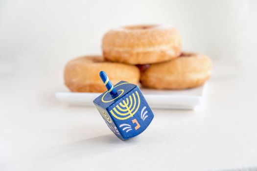 The Symbols of Hanukkah - sufganiyot and sevivon