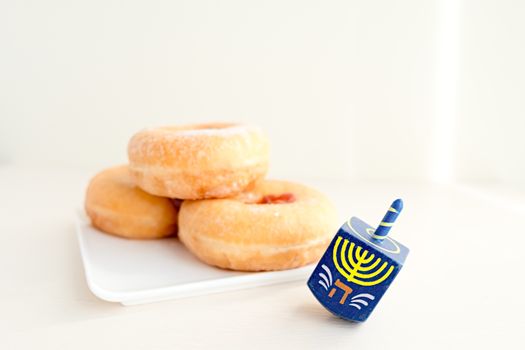 The Symbols of Hanukkah - sufganiyot and sevivon