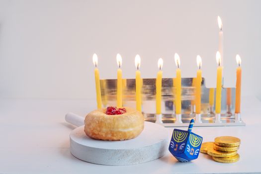 The Symbols of Hanukkah - nine-branched mehorah Hanukiah , sufganiyot, chocolate coins and sevivon