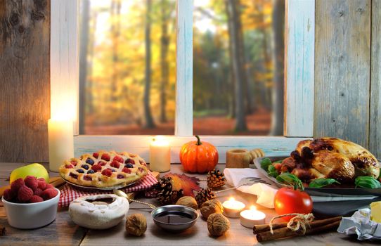 Thanksgiving food by a window overlooking a forest