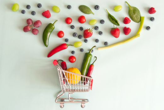 Small shopping cart with fruits and vegetables