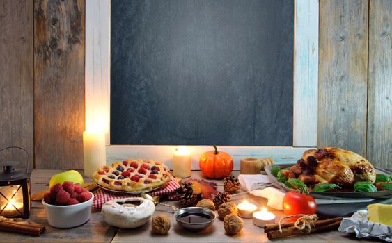 Thanksgiving food around an empty chalkboard