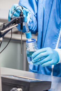 Scientist using a ph meter at laboratory