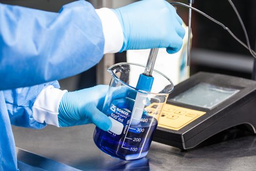 Scientist using a ph meter at laboratory