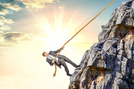 Businessman climb a mountain. Achievement business goal concept