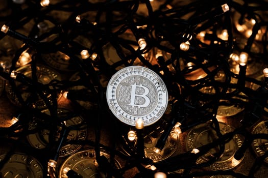 Digital currency physical metal bitcoin coin on the christmas concept.