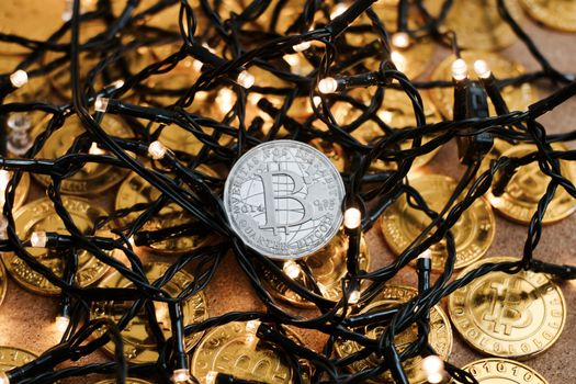 Digital currency physical metal bitcoin coin on the christmas concept.
