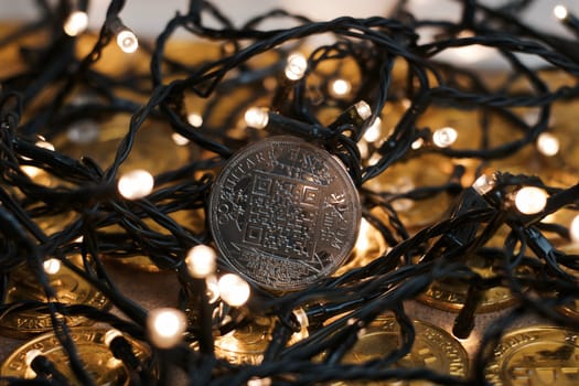 Digital currency physical metal bitcoin coin on the christmas concept.