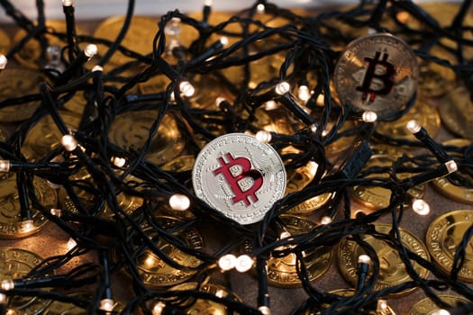 Digital currency physical metal bitcoin coin on the christmas concept.