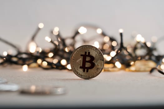 Digital currency physical metal bitcoin coin on the christmas concept.