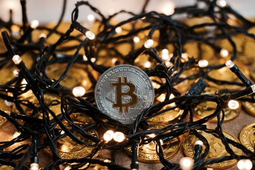 Digital currency physical metal bitcoin coin on the christmas concept.