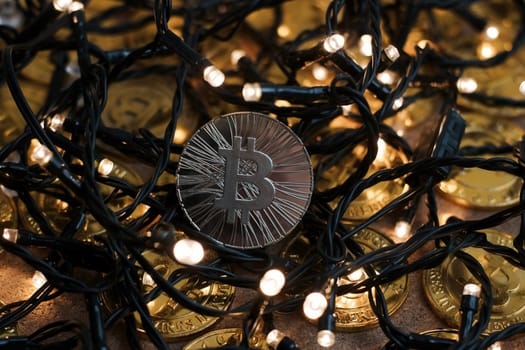 Digital currency physical metal bitcoin coin on the christmas concept.