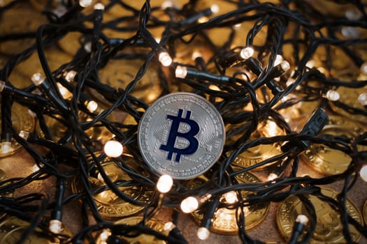 Digital currency physical metal bitcoin coin on the christmas concept.