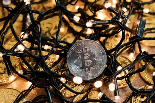 Digital currency physical metal bitcoin coin on the christmas concept.