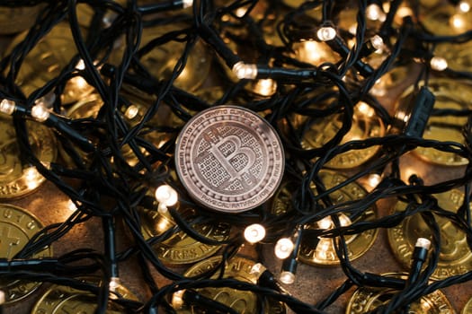Digital currency physical metal bitcoin coin on the christmas concept.