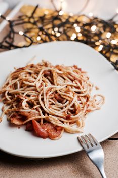 Italian tasty and fresh pasta on white plate. Christmas food concept.