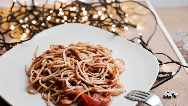 Italian tasty and fresh pasta on white plate. Christmas food concept.