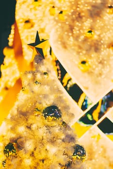 Yellow christmas ornaments on tree