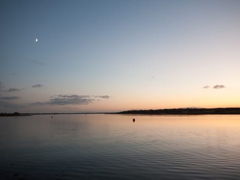 beautiful sunset evening bay scene open space water surface waves; essex; england; uk