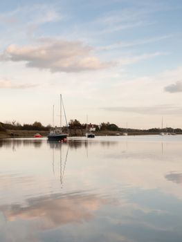 boats in harbour masts landscape river lake water surface clear; essex; england; uk