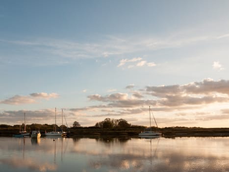 boats parked on river harbour water landscape; essex; england; uk