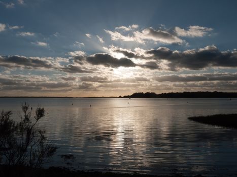 beautiful sunset over harbour coast sea bay clouds silhouette landscape; essex; england; uk