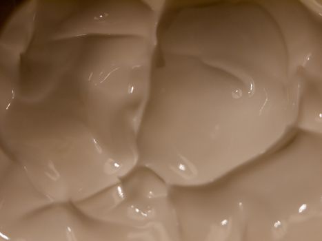 close up of white cream moisturizer inside glass tub; essex; england; uk