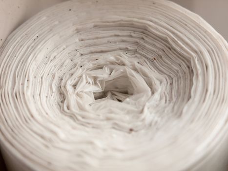 close up of twist spiral top of white bags rolled; essex; england; uk