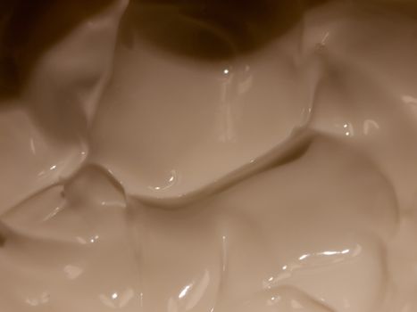 close up of white cream moisturizer inside glass tub; essex; england; uk