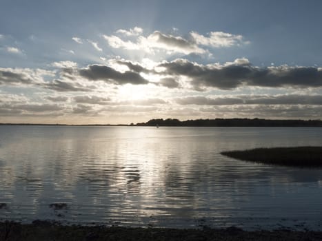 beautiful landscape open water ocean sea top surface sunset dramatic clouds; essex; england; uk